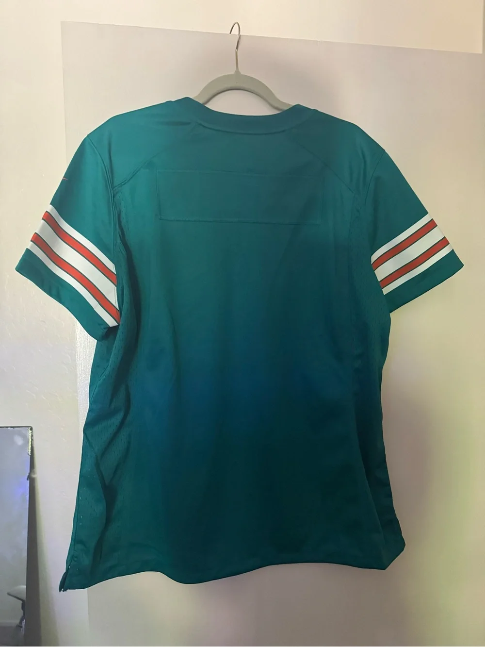 Nike Teal Kids Football Jersey with White & Orange Sleeve Stripes